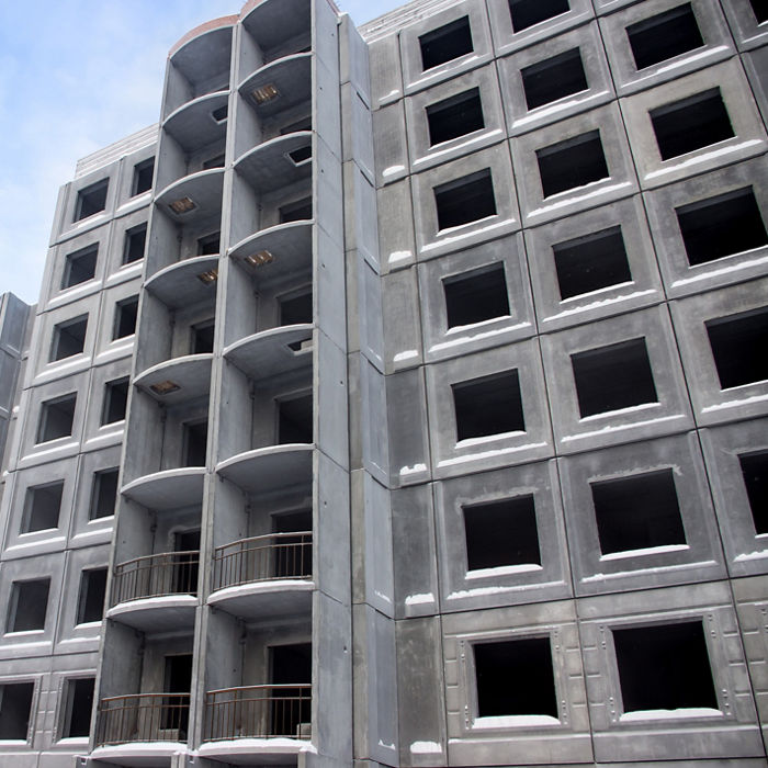 Unfinished building of reinforced concrete panels without windows; Shutterstock ID 170797346