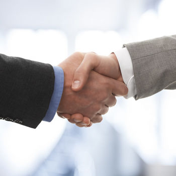Two business men shaking hands; Shutterstock ID 134066510