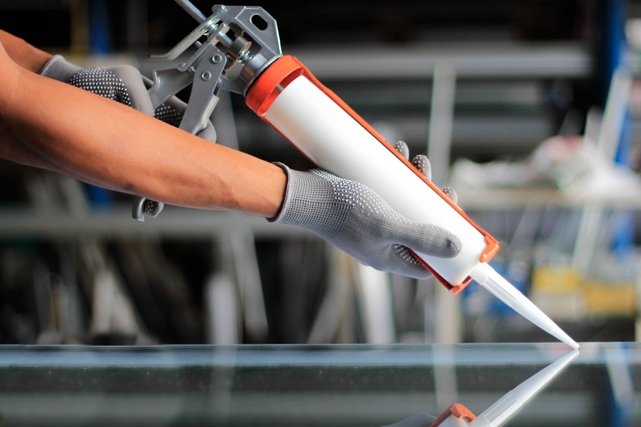 Arms with caulk adhesive