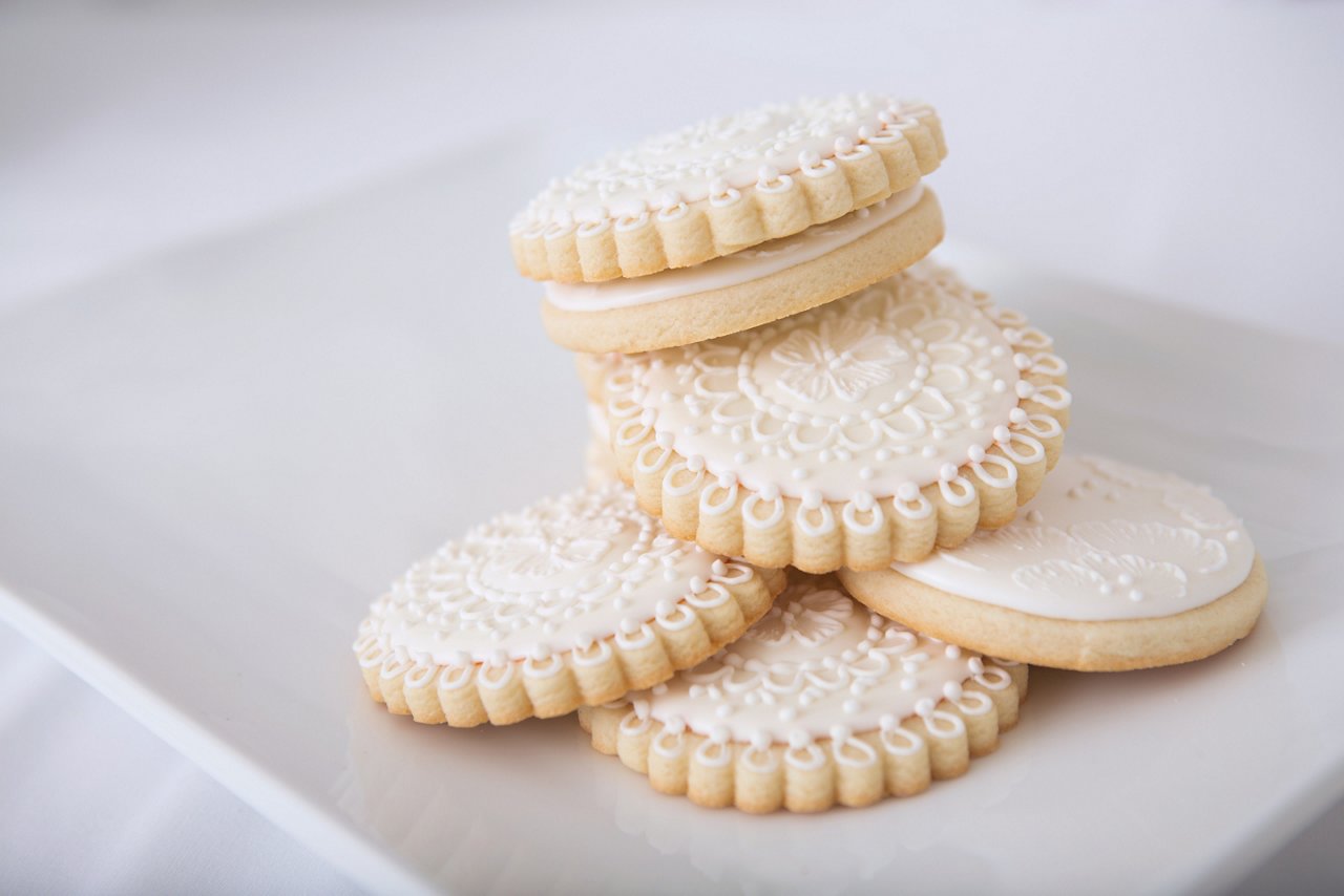 Beautifully decorated fancy wedding cookies stacked on a white platter.
186713579
Baked, Beautiful, Collection, Cookie, Dessert, Fragility, Gourmet, Indulgence, Lifestyles, Luxury, Number 6, Ornate, Selective Focus, Snack, Stack, Sweet Food, Tray, Wedding, Wedding Cookie, White