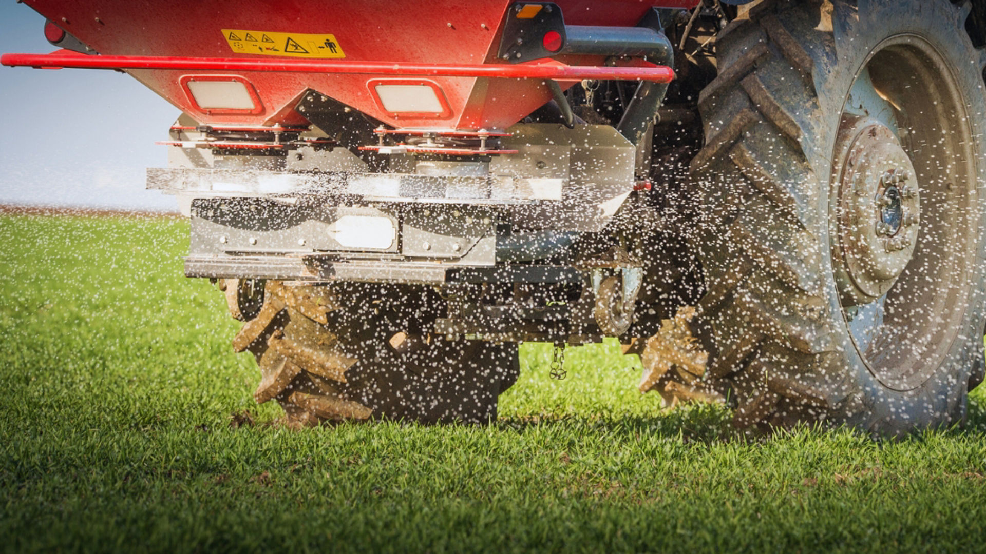 Tractor spreading granules