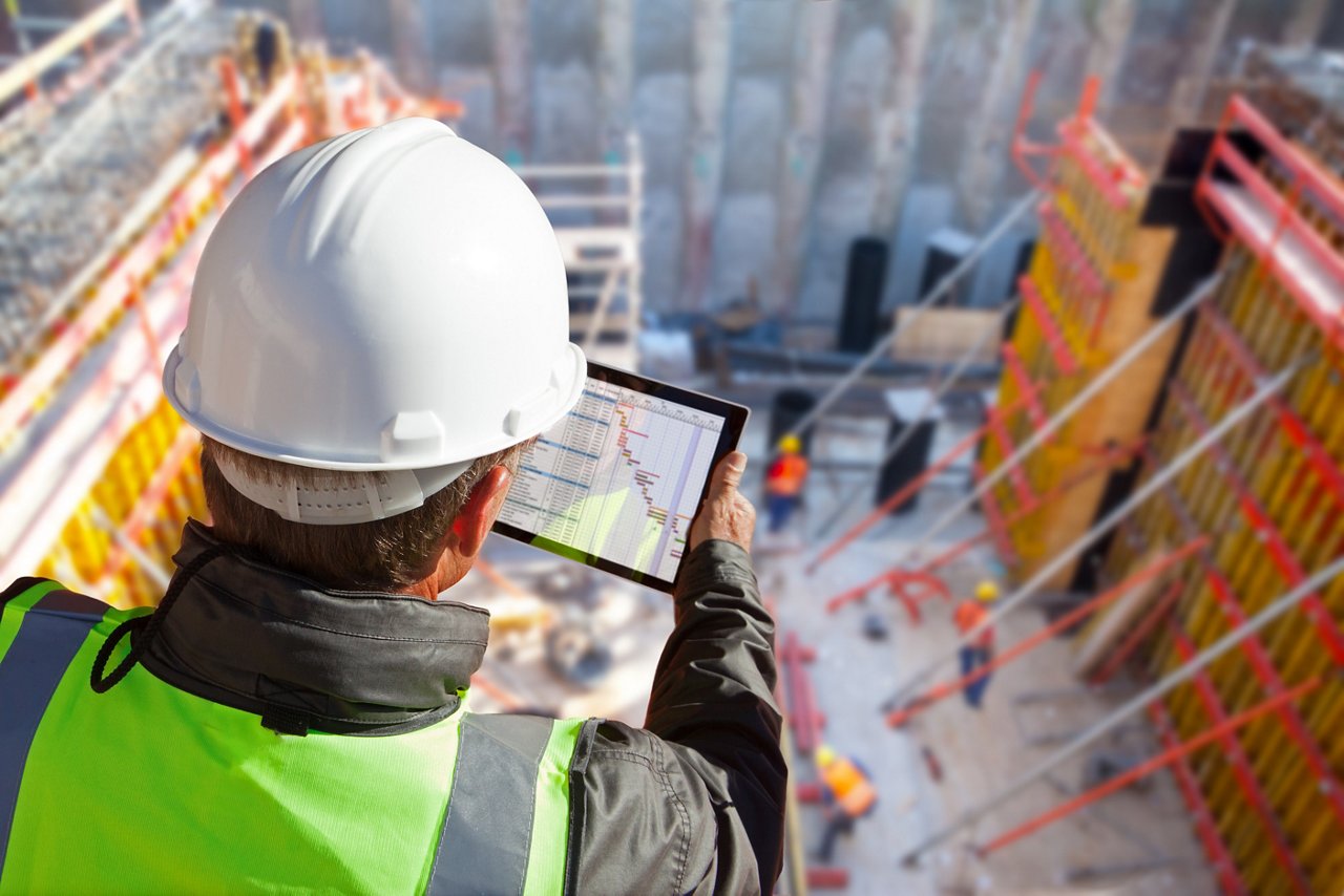 civil engineer or architect with hardhat on construction site checking schedule on tablet computer; Shutterstock ID 1039121731; purchase_order: CON; job: Projects & jobsites; client: CON; other: CON