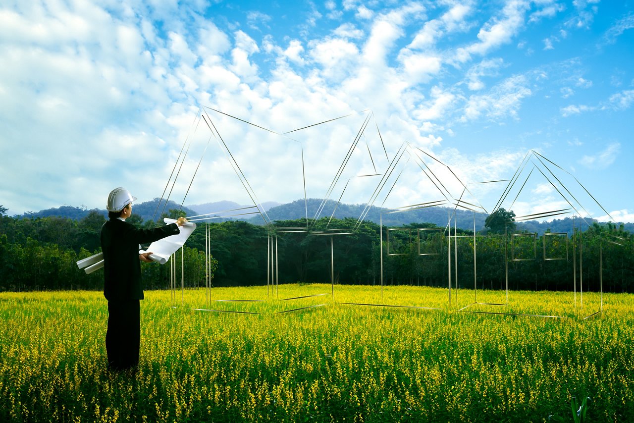 Civil engineer planing at empty landscape with house building drawing in background; Shutterstock ID 252751099; purchase_order: CON; job: ; client: ; other: 