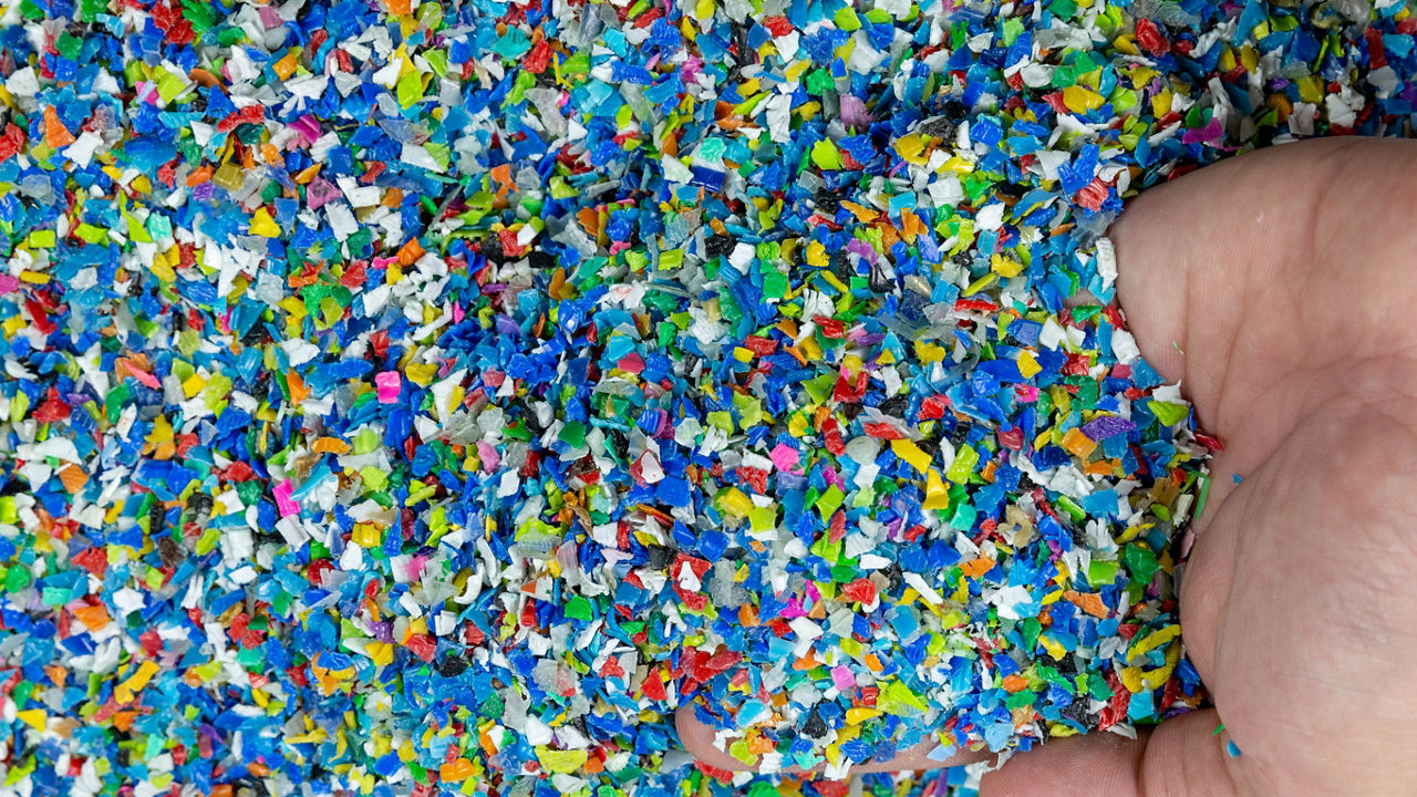 Close-up of plastic polymer granules. hand hold Polymer pellets. polymer plastic. compound polymer.; Shutterstock ID 1673297089; purchase_order: POL_website_Recycling; job: ; client: ; other: 