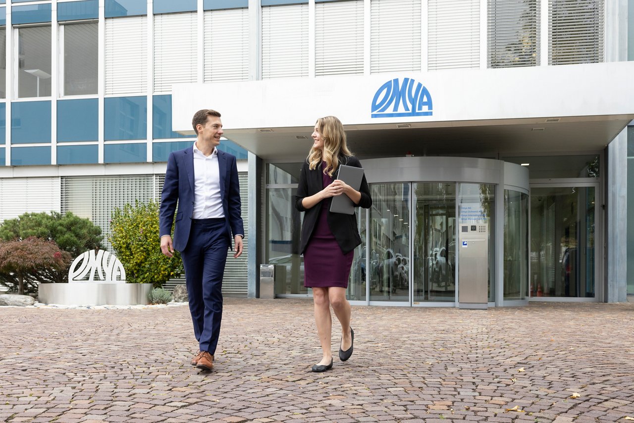 Man and woman leaving office building