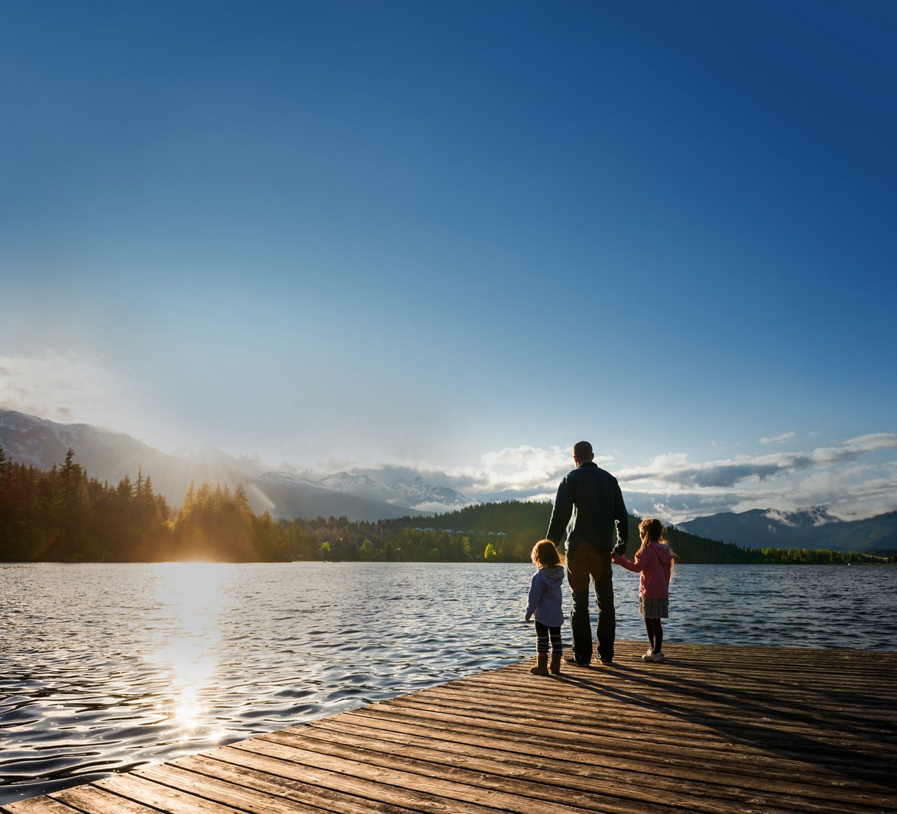 Family in front of a lake