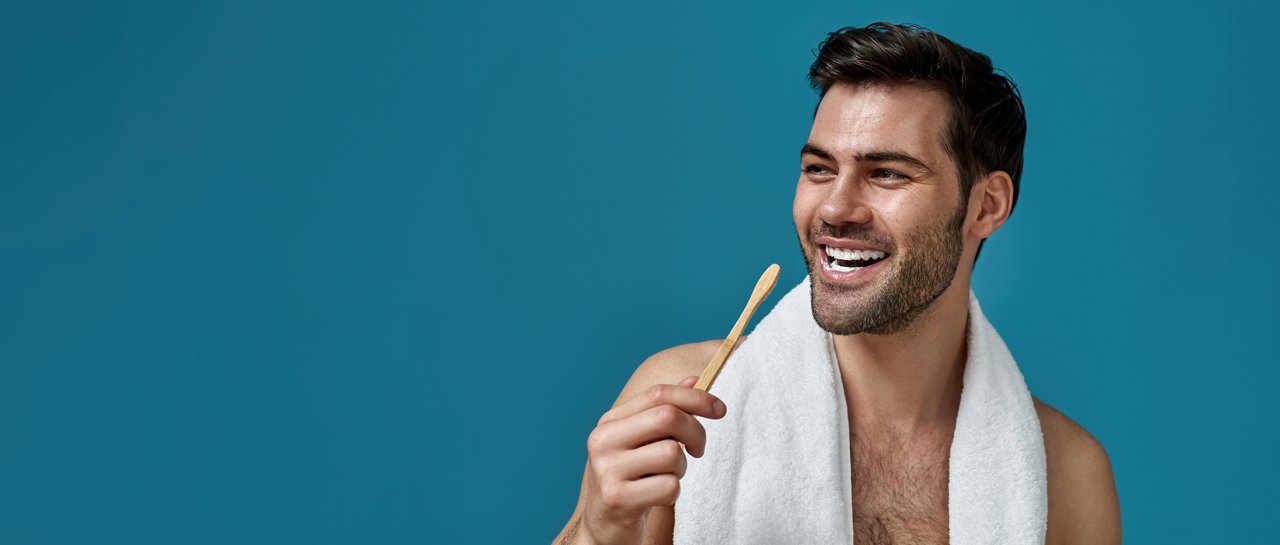 Beauty portrait of cheerful bearded man with towel around neck smiling away with toothpaste in his mouth while brushing teeth isolated over blue background. Dental care concept; Shutterstock ID 1994122868; purchase_order: Literature; job: Formulation Sheets; client: Phana Tuon; other:
1994122868