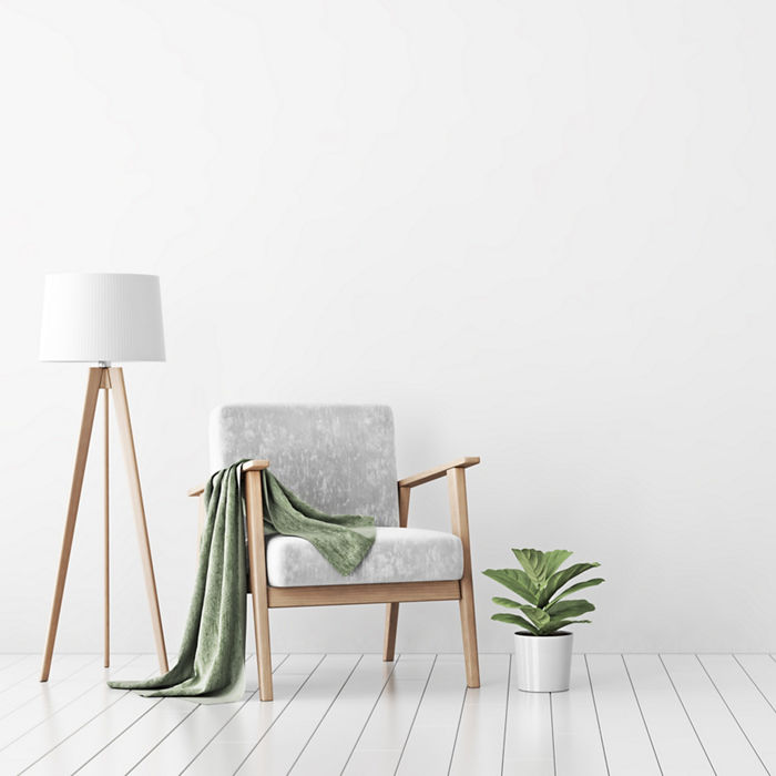 wooden_chair_and_lamp_in_front_of_white_matt_wall