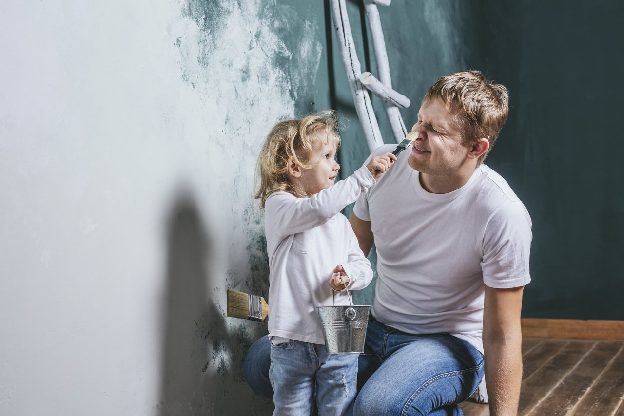 Family, happy daughter with dad doing home repair, paint walls, together with love; Shutterstock ID 501465535