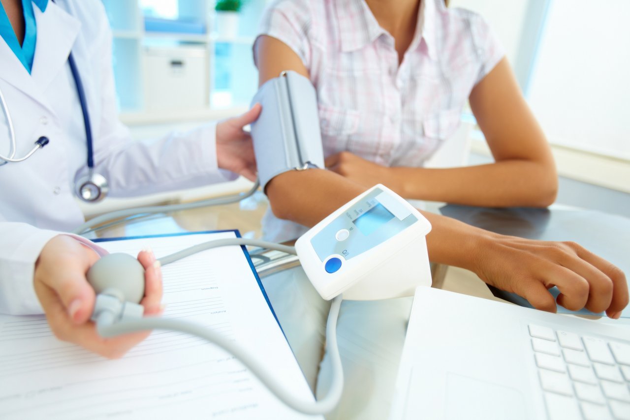 Doctor taking a patient's blood pressure