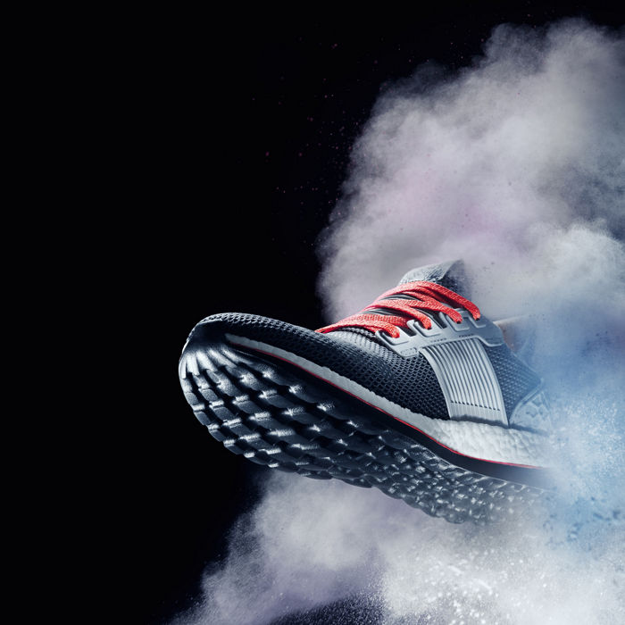 close up view of nice sport shoe is getting out of dusty cloud ; Shutterstock ID 657573118
