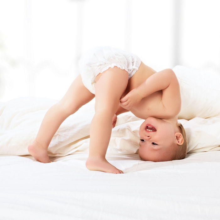 happy baby child play fun in bed; Shutterstock ID 165419738; purchase_order: Polymers Website_Omyafiber; job: ; client: ; other: 