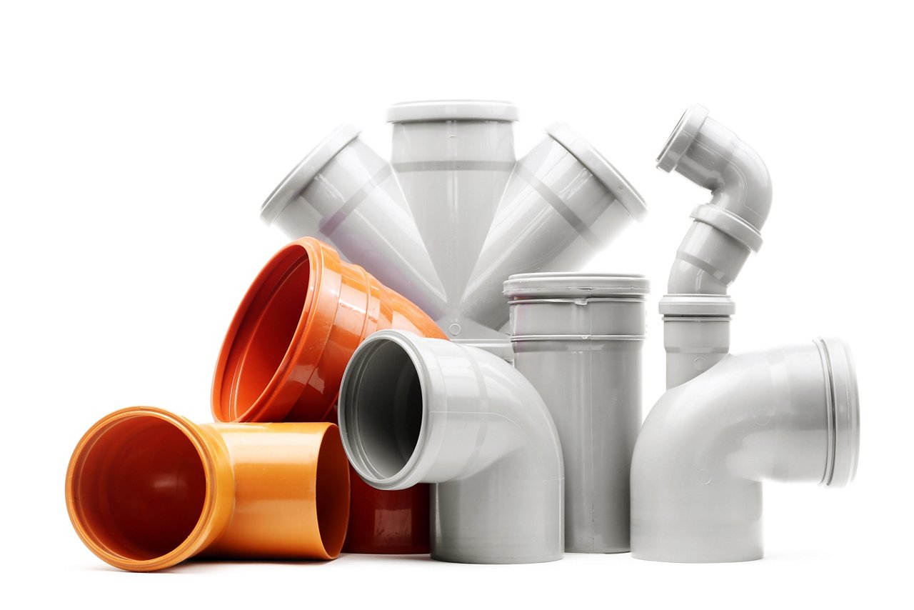 New gray and brown drain pipes isolated over white