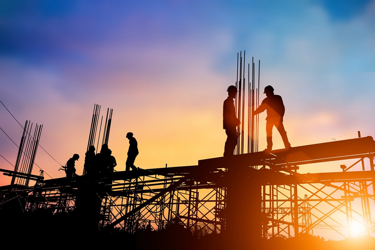 Silhouette of workers in a construction site