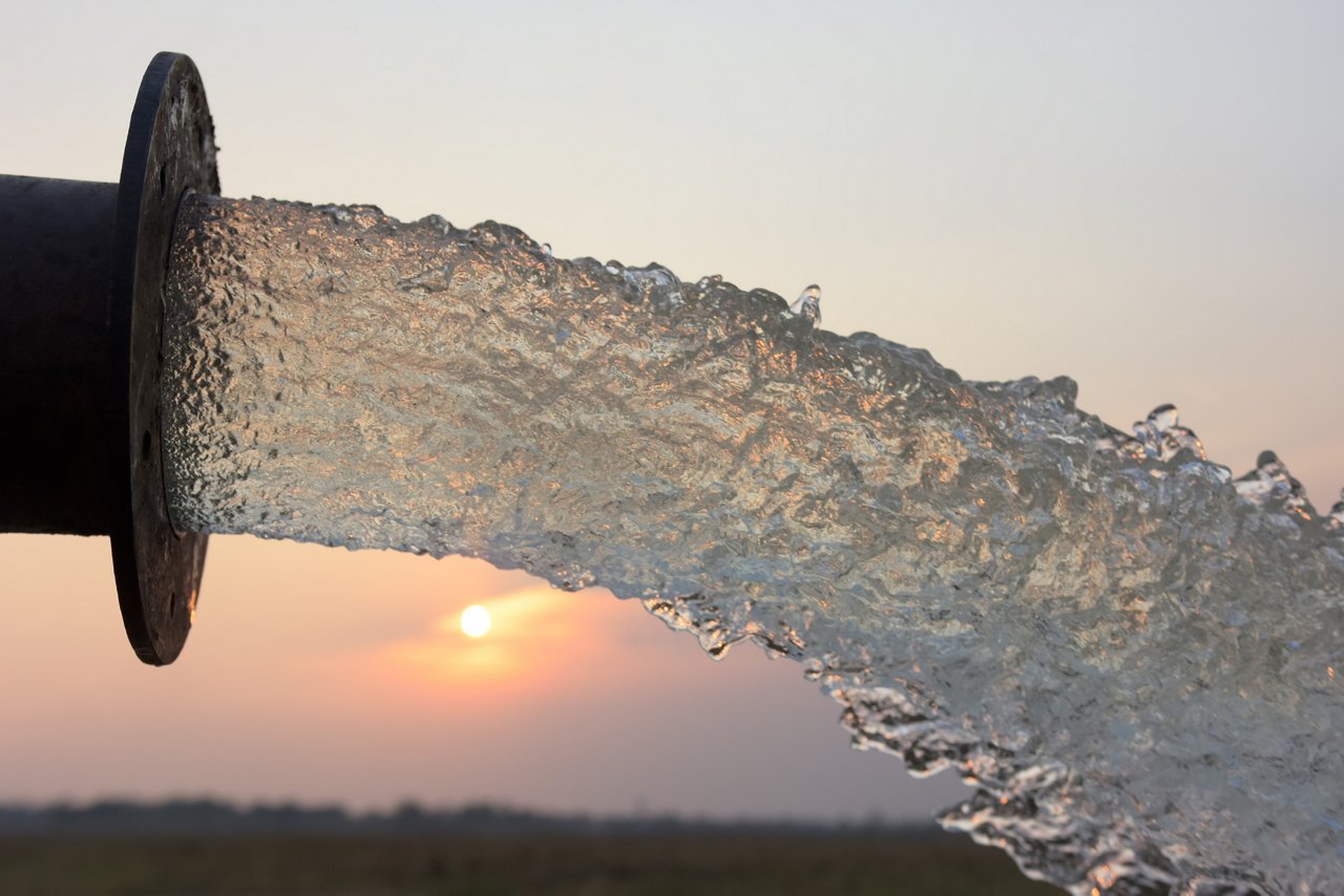 water flow from pipe , sunset and abstract