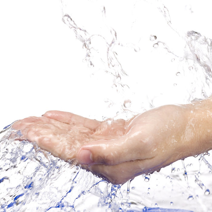 Water splashing on the hand on white background; Shutterstock ID 61227967; Purchase Order: EVS Water Treatment