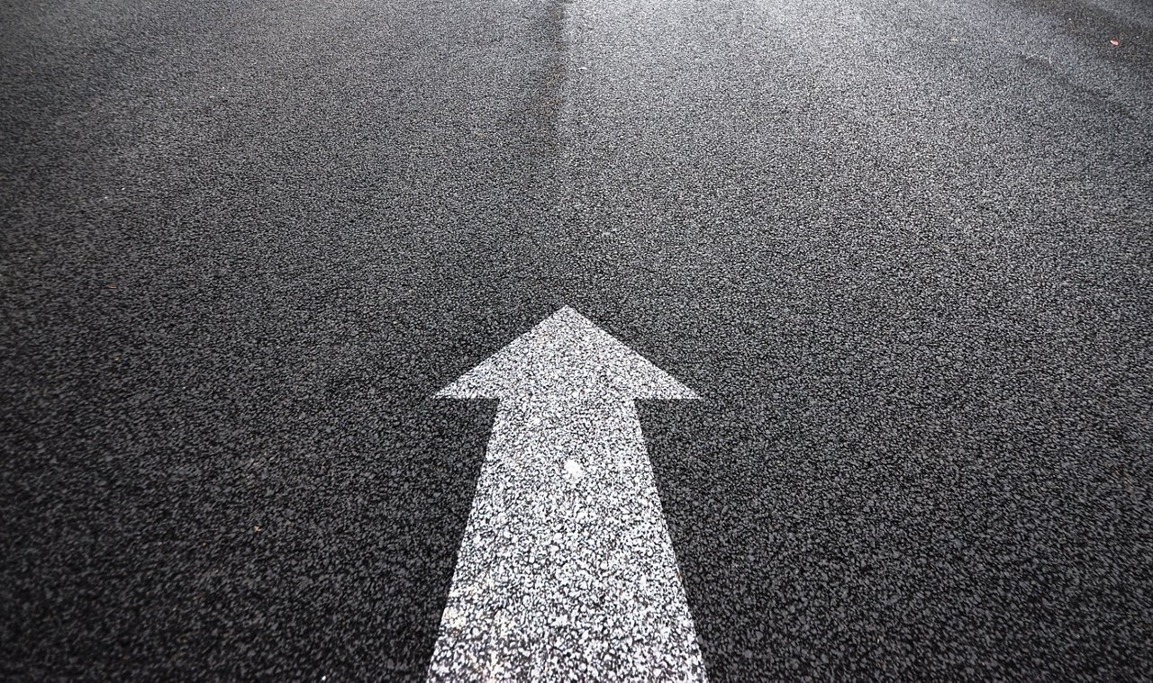 road in city with sunset