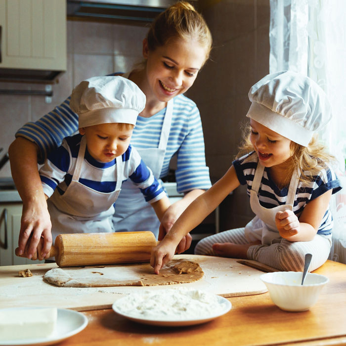 happy family in the kitchen. mother and  children preparing the dough, bake cookies
; Shutterstock ID 583771249