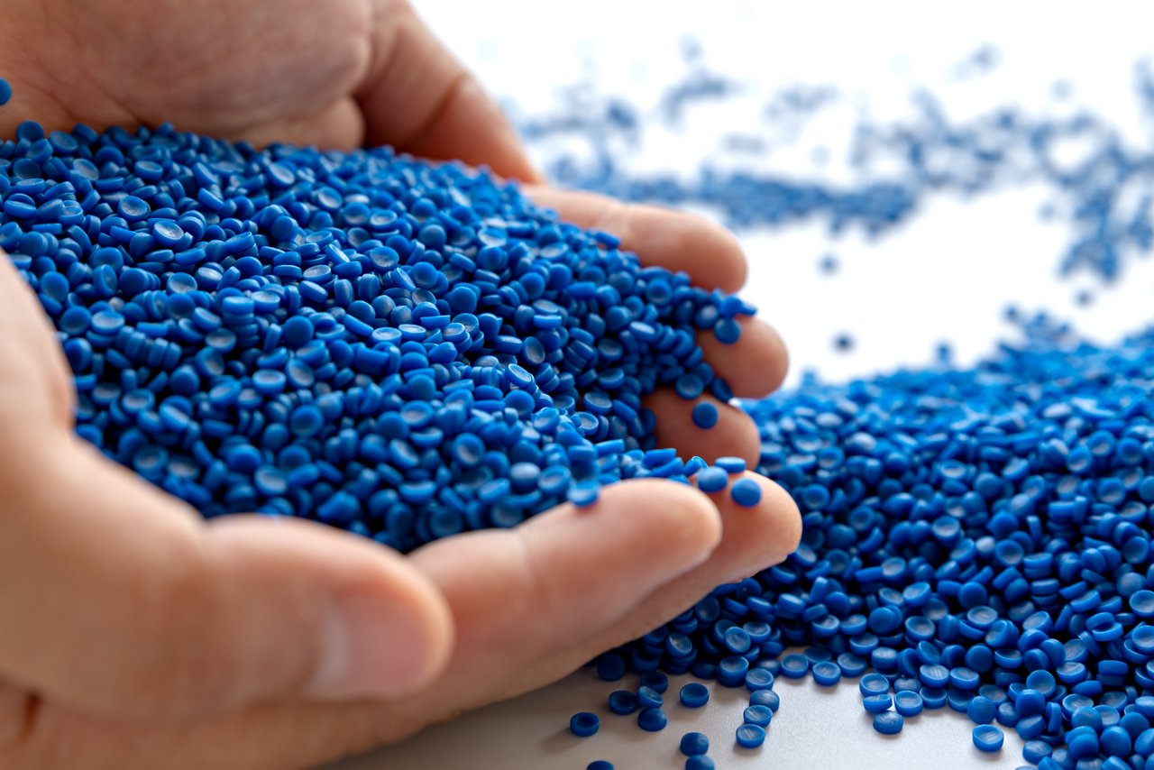 Blue plastic grain, plastic polymer granules,hand hold Polymer pellets, Raw materials for making water pipes, Plastics from petrochemicals and compound extrusion, resin from plant polyethylene.; Shutterstock ID 1805518771; purchase_order: -; job: -; client: -; other: -