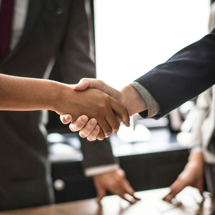 Business people shaking hands in a meeting room