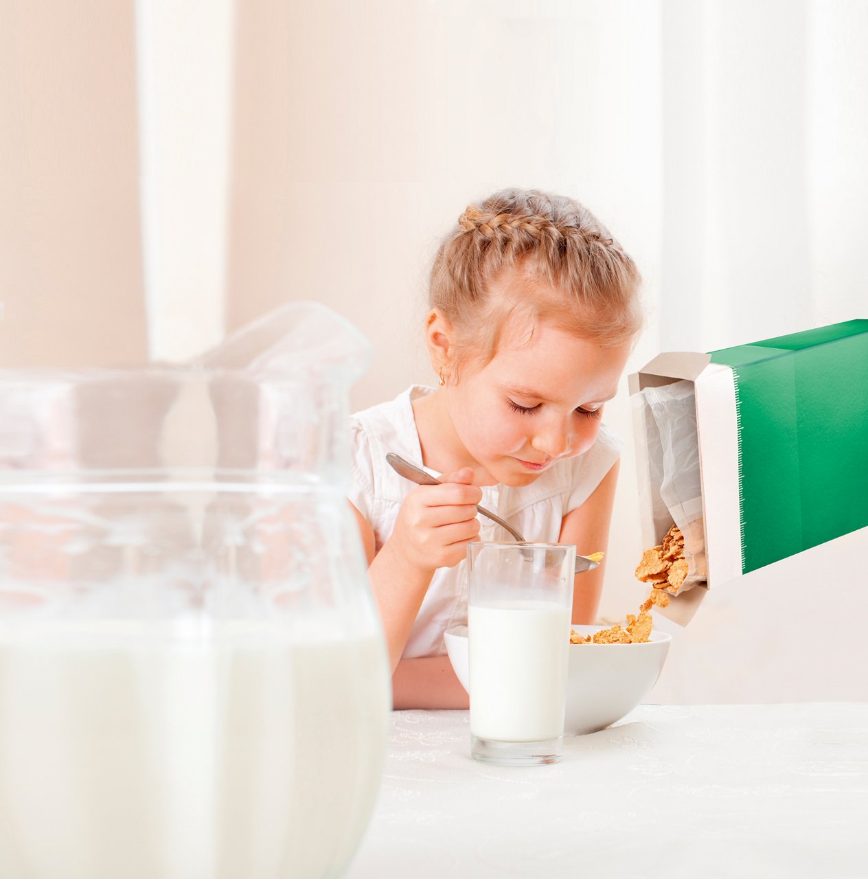 young child eating breakfast cereal