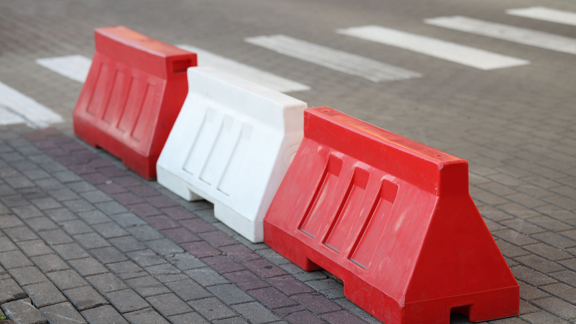roadblocks paving pedestrian crossing red white ; Shutterstock ID 2257567147; purchase_order: Polymers website_building materials; job: ; client: ; other: 