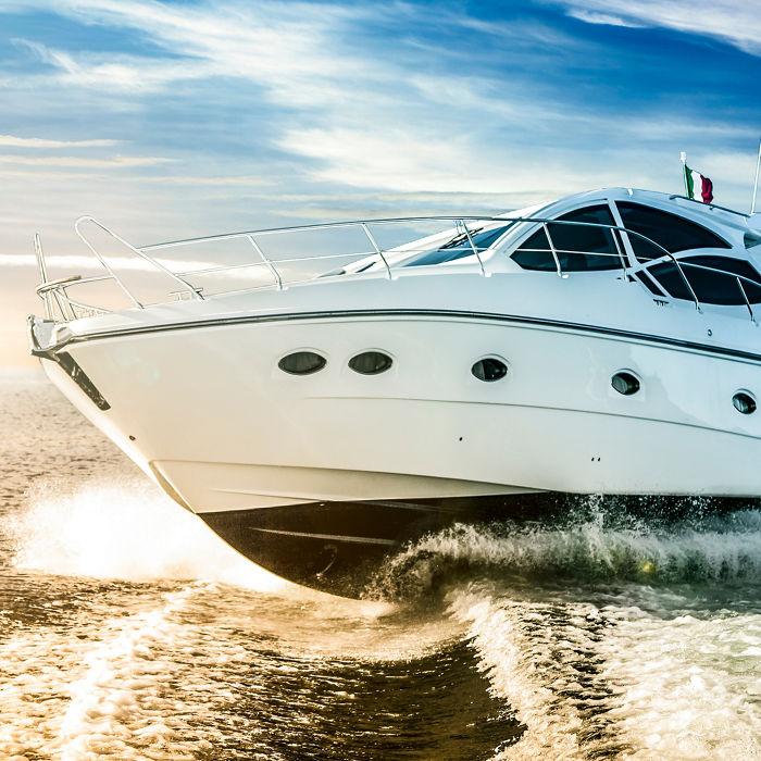 Motor boat sailing the sea at dawn