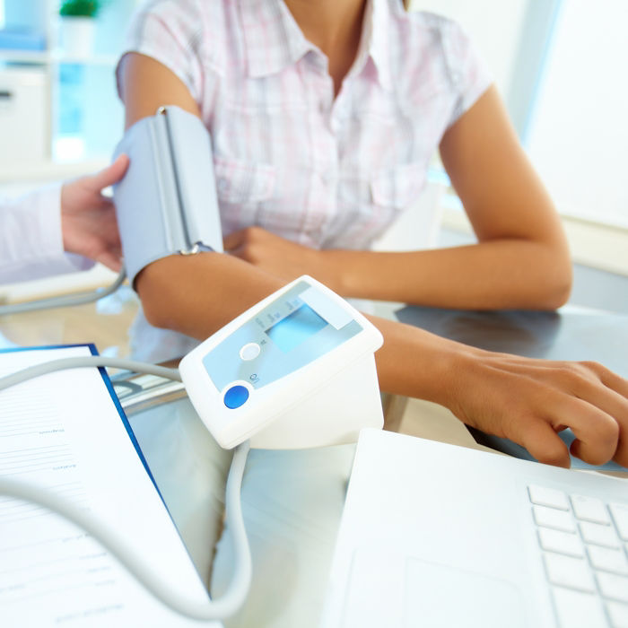 Close-up of tonometer by patientÃ?Â¢??s arm during blood pressure measuring at medical consultation
110196416