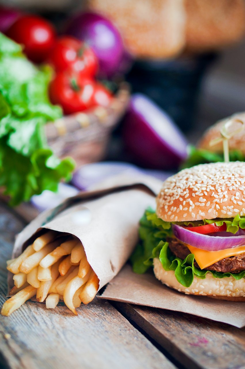 Closeup of home made burgers on wooden background; Shutterstock ID 172259927