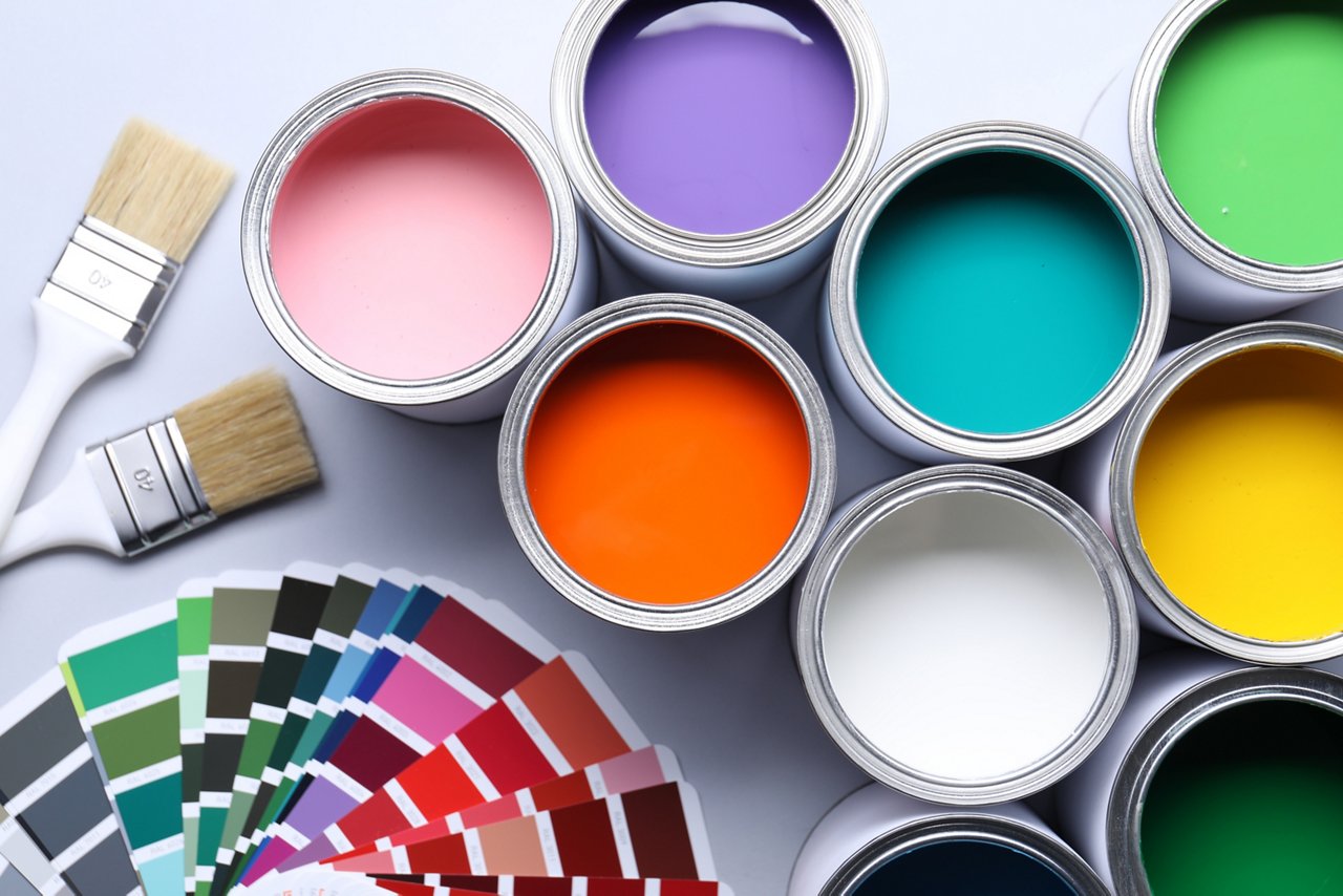 Cans of bright paints, brushes and color palettes on grey background, flat lay; Shutterstock ID 2603051265; purchase_order: CORP; job: Turkey Landing Page; client: ; other: 