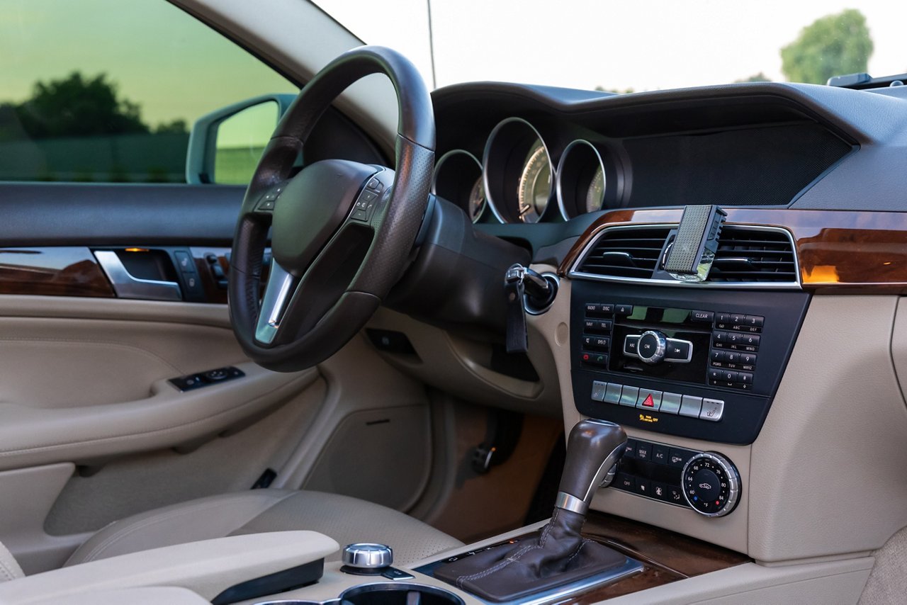 Elegant car interior with a sophisticated dashboard, plush seats, and stylish design elements