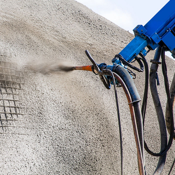 Sprayed concrete by machines