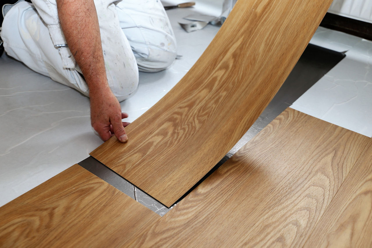 Man laying PVC-floor; Shutterstock ID 582115630