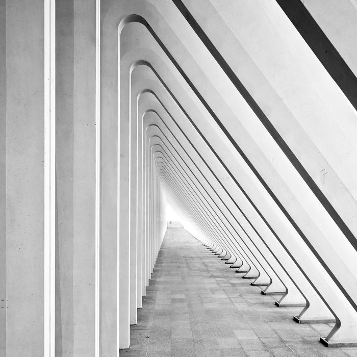 Modern tunnel in futuristic interior with concrete arches in perspective