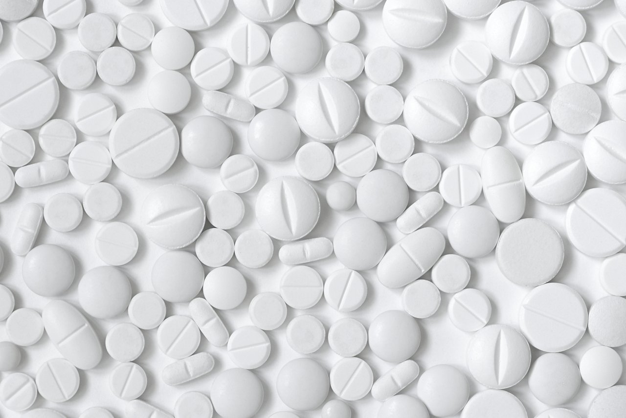 White pills, white background
